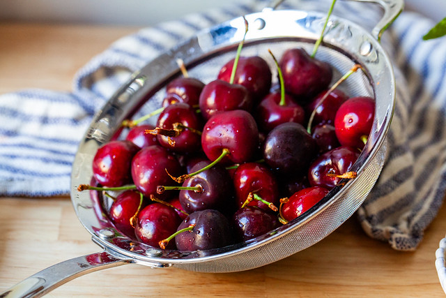 burrata with crushed cherries and pistachios
