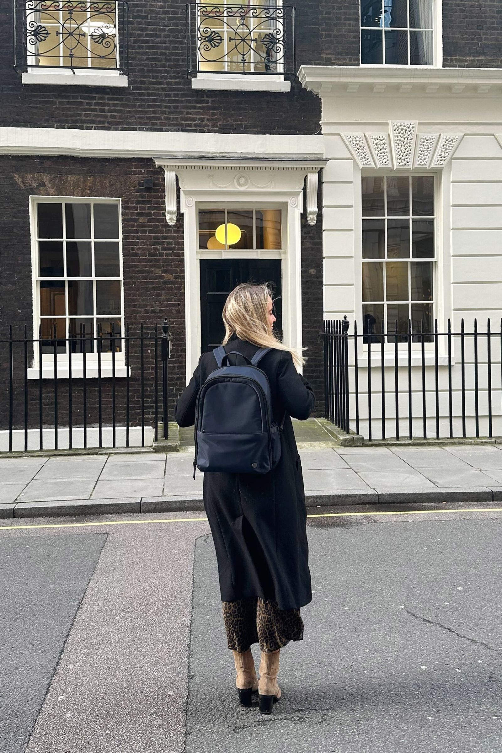 Image may contain Pedestrian Person Adult and Bag