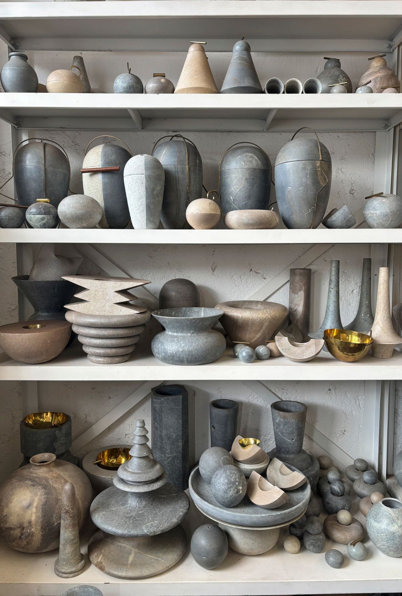 Image may contain Pottery Shelf Cookware Pot Furniture Ammunition Grenade Weapon Closet and Cupboard