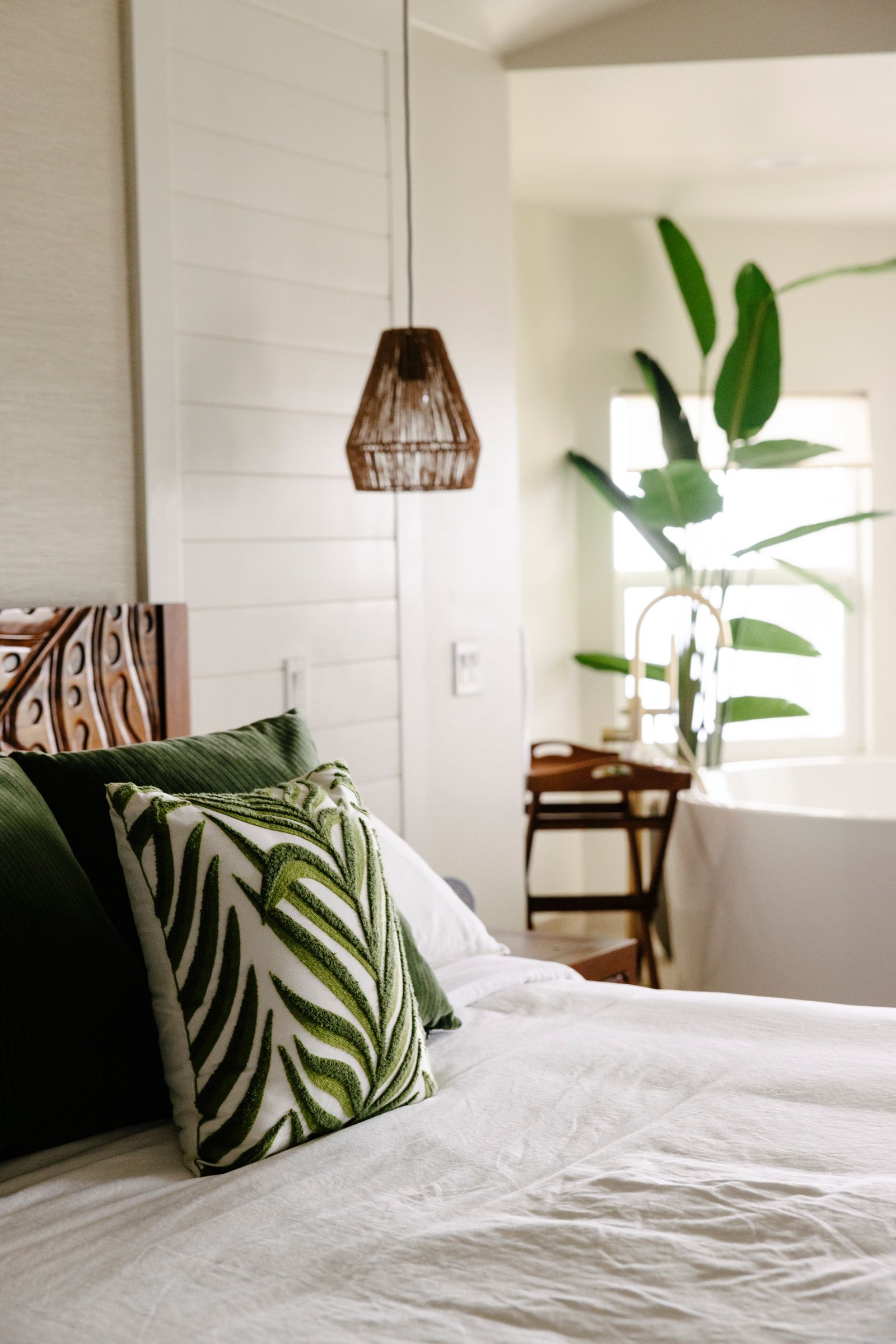 Image may contain Cushion Home Decor Pillow Indoors Interior Design Bed Furniture Chair Lamp and Plant