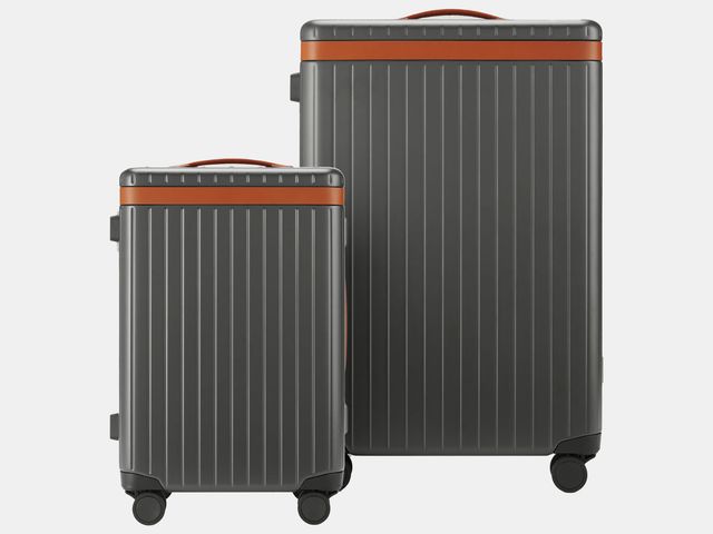 two grey and tan rolling suitcases