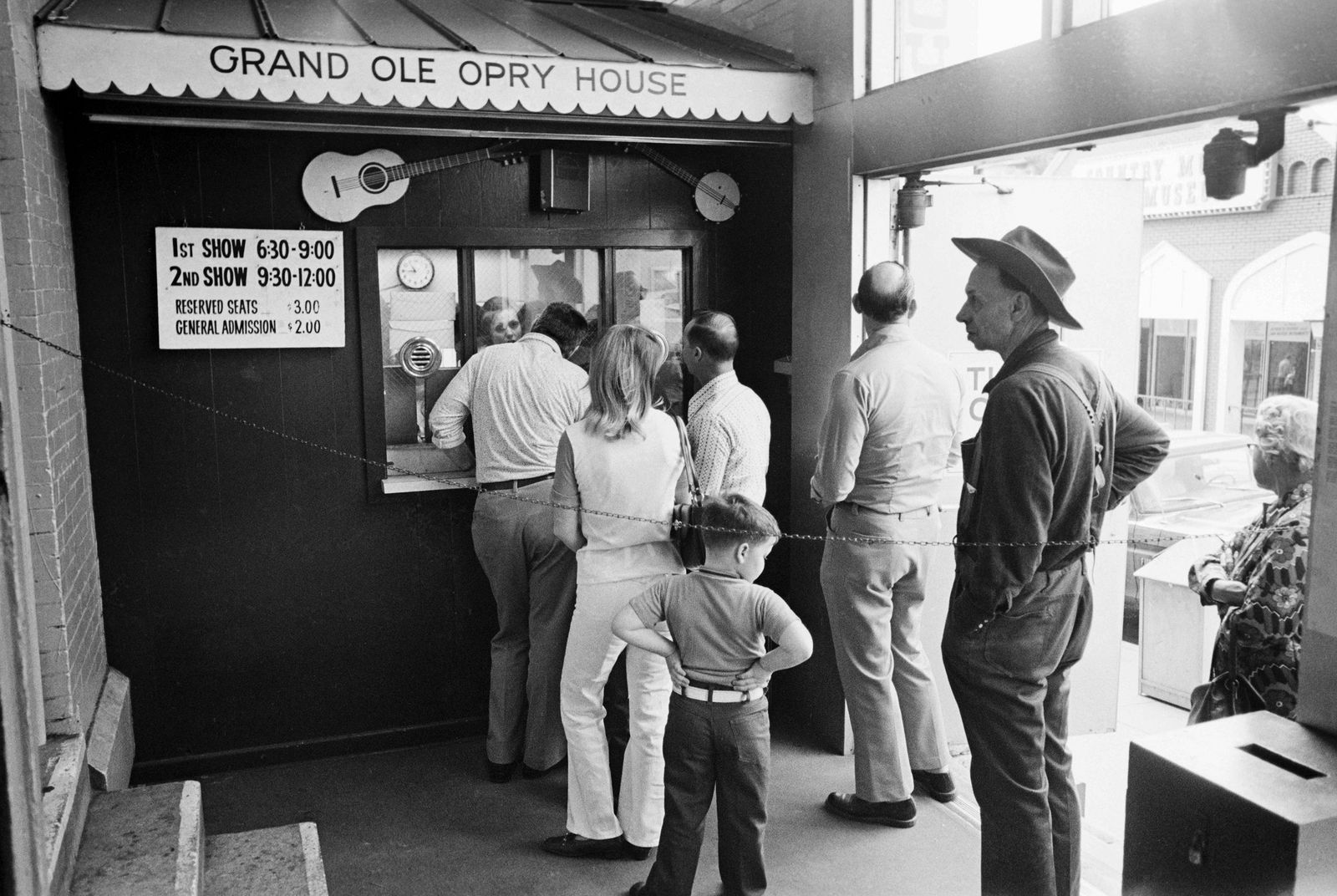 Image may contain Adult Person Baby Clothing Pants Guitar Musical Instrument Accessories Belt Footwear and Shoe