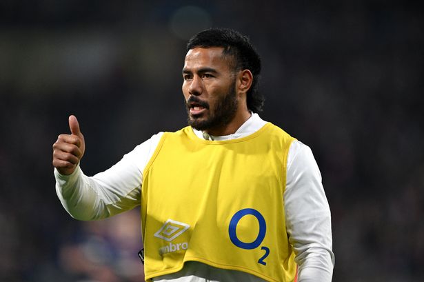 Manu Tuilagi of England gives a thumbs up from the sidelines during the Guinness Six Nations 2024 match between France and England at Groupama Stadium on March 16, 2024 in Lyon, France.