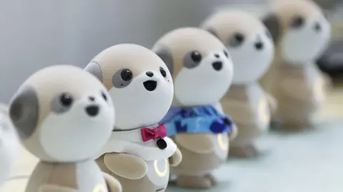 Getty Images Lineup of Sharp Poketomo robots at Ceatec in Chiba, Japan