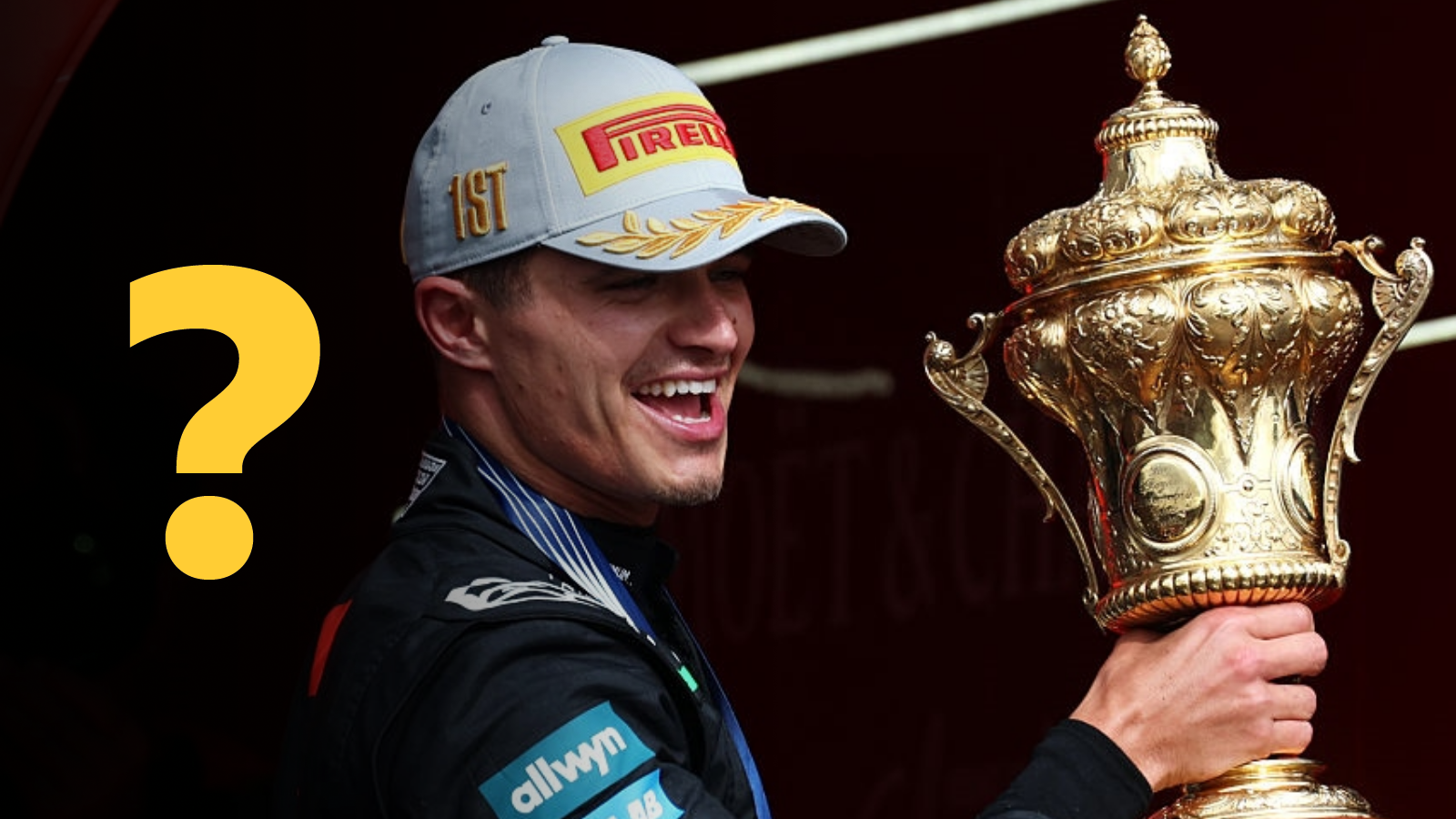 Lando Norris holds the British Grand Prix winner's trophy at Silverstone