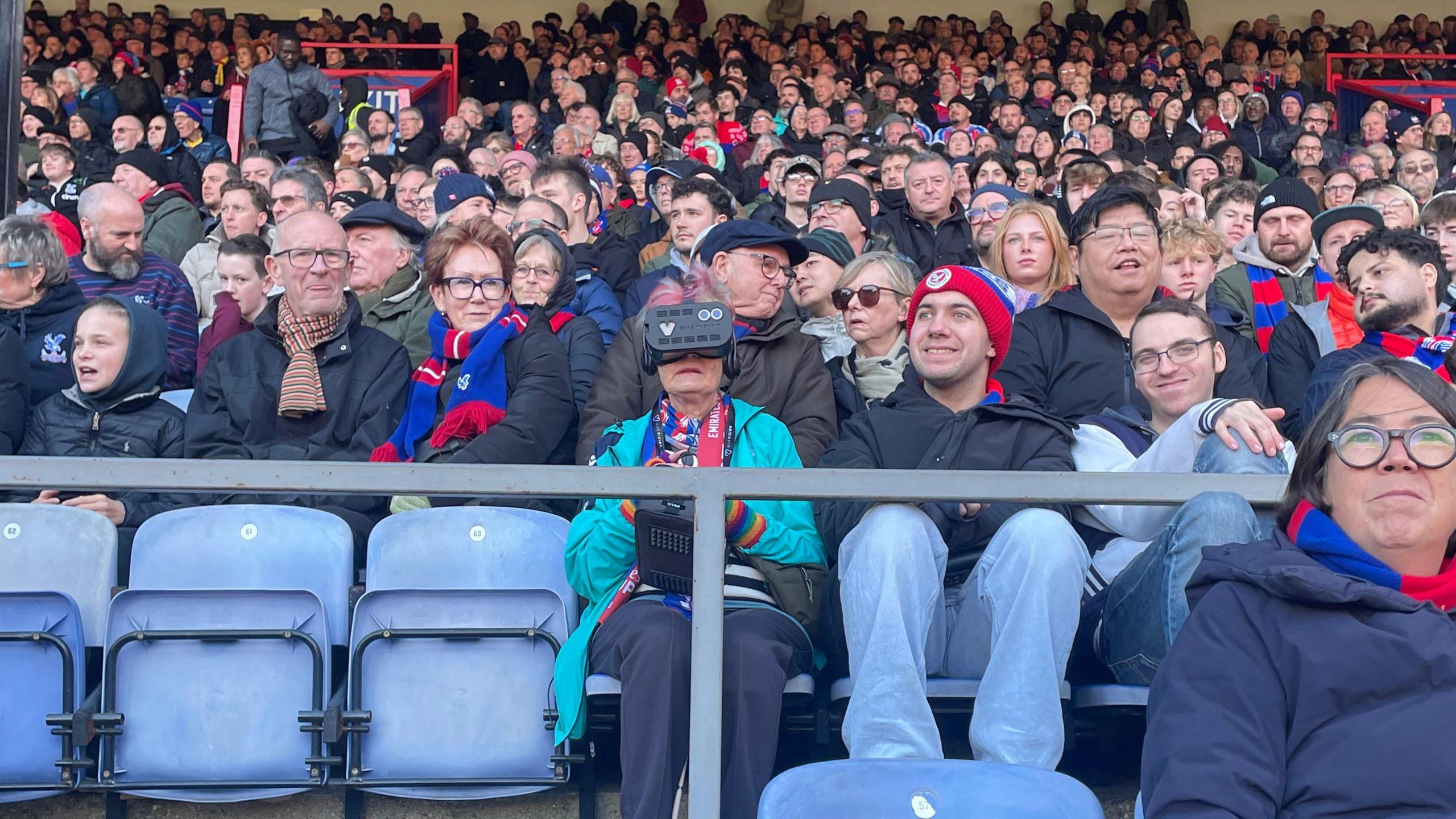 Susan Venon using the GiveVision headset whilst watching the game