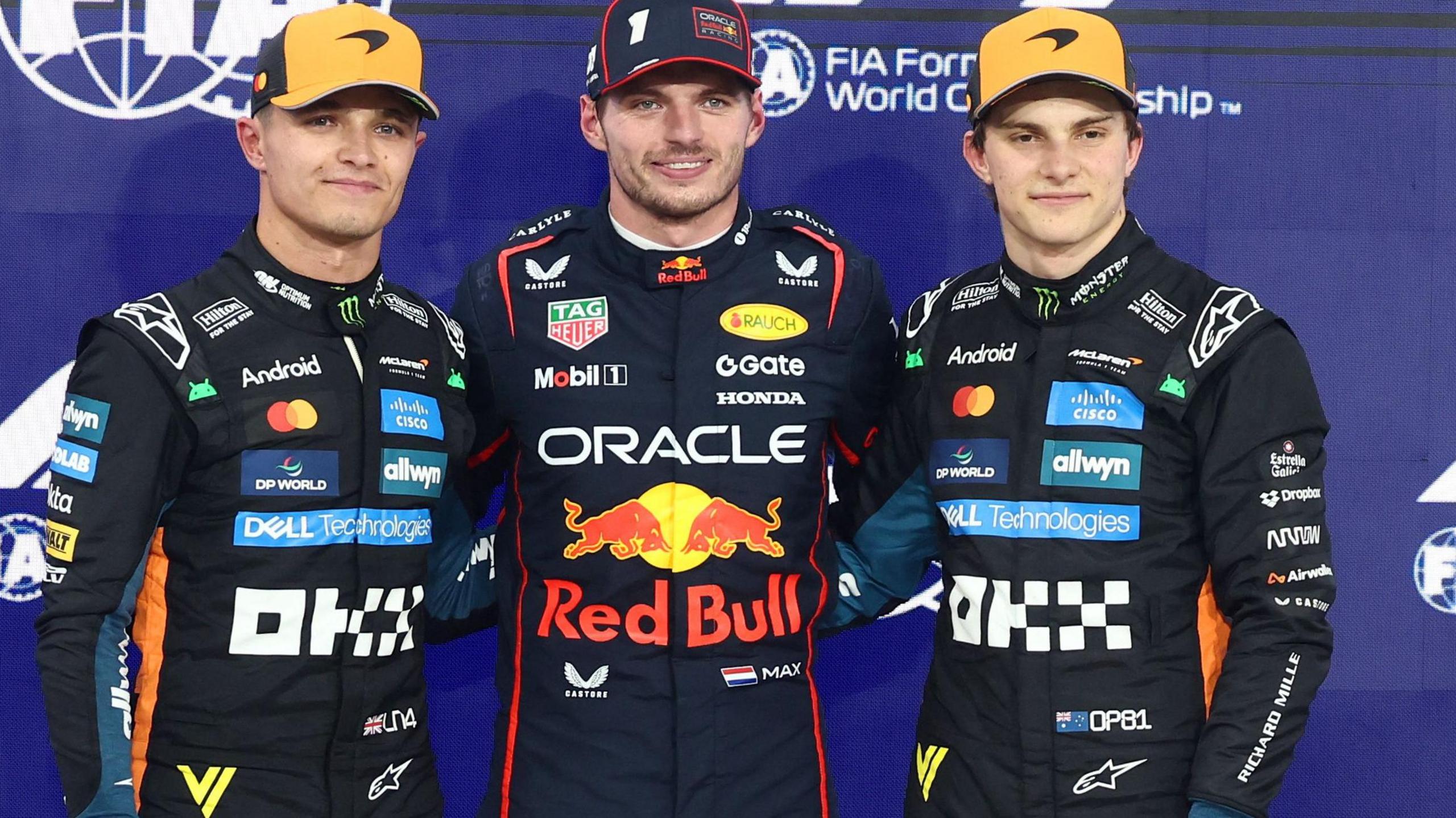 Left to right: Lando Norris, Max Verstappen and Oscar Piastri pose for pictures after qualifying for the Abu Dhabi Grand Prix