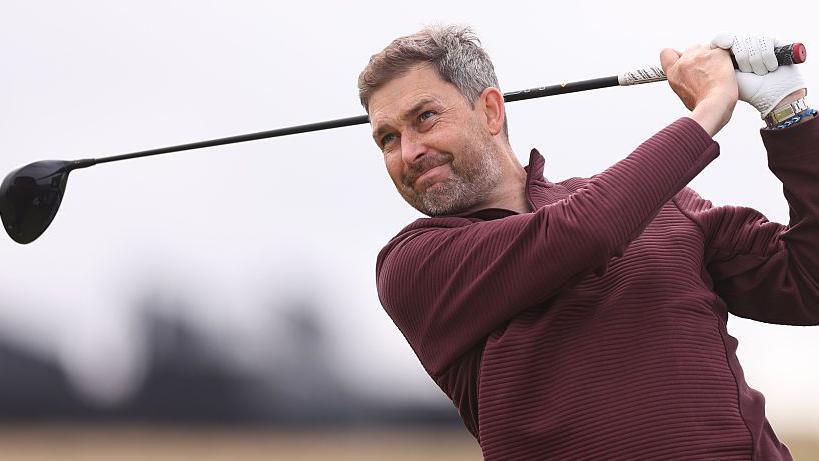 R&A chief executive Mark Darbon hitting a golf shot