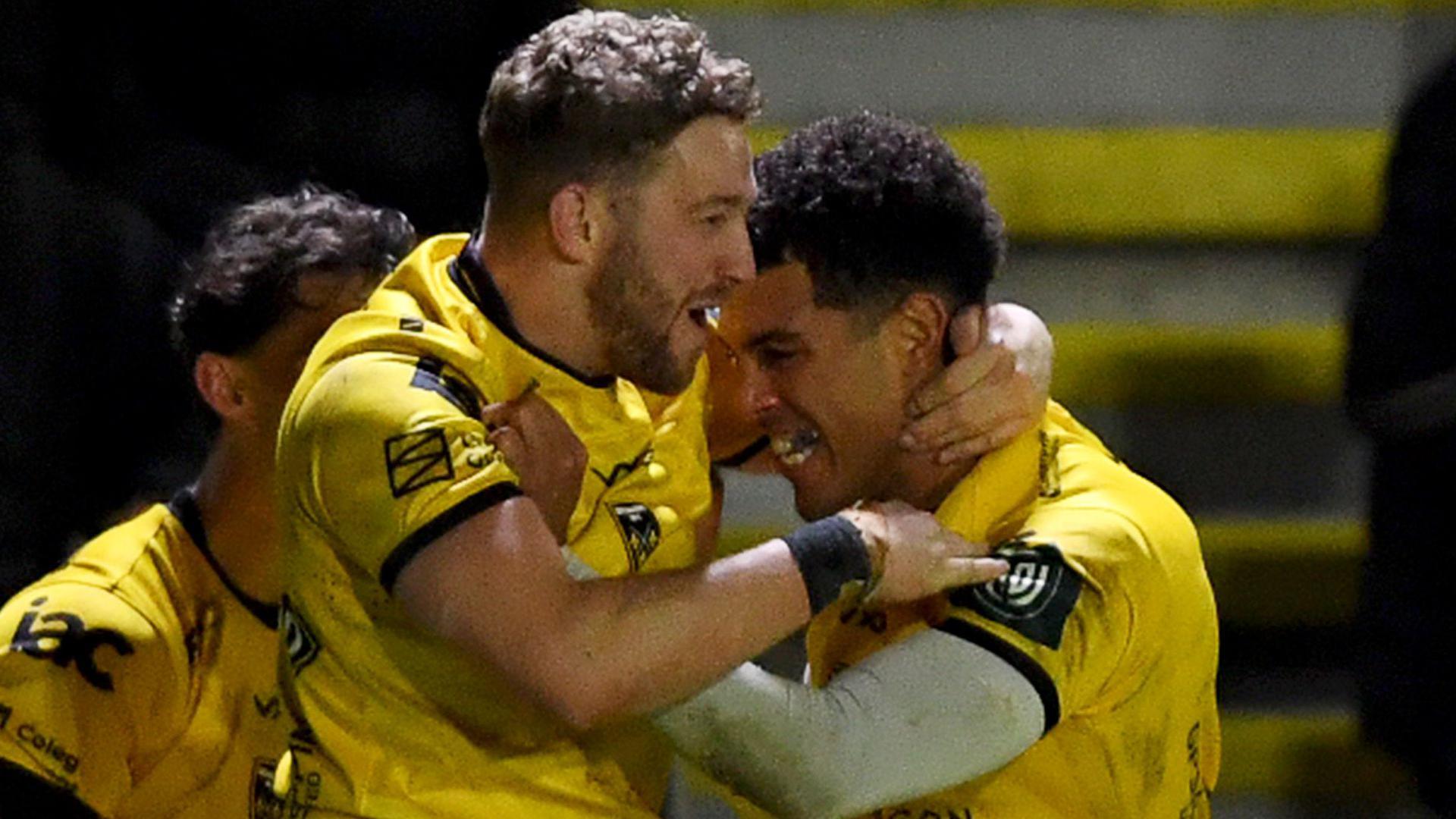 Dragons co-captain Angus O'Brien celebrates with Rio Dyer