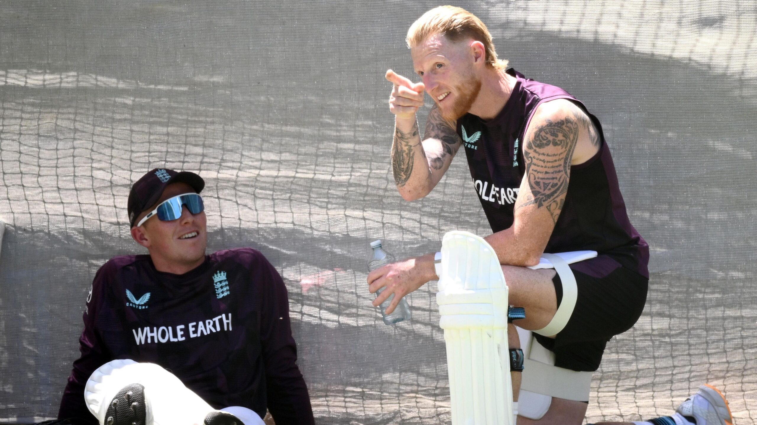 Zak Crawley looks up to a pointing Ben Stokes at practice