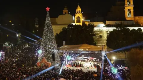 Bethlehem Christmas tree lights up for first time since start of Gaza war