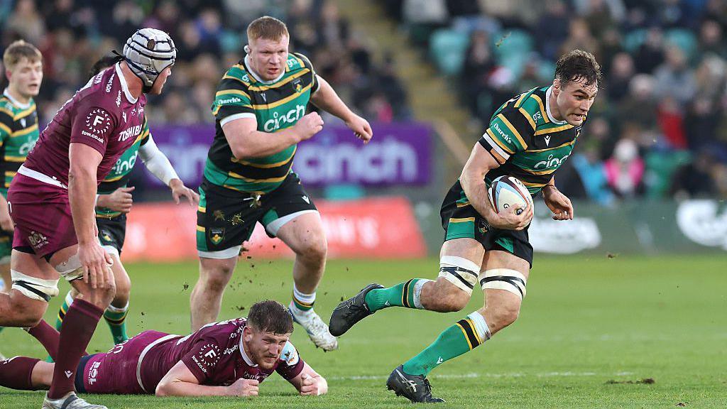 Josh Kemeny charges through the Sale defence on his way to scoring a magnificent try. Unsuccesful tackler Jacques Vermuelen watches him from the floor.