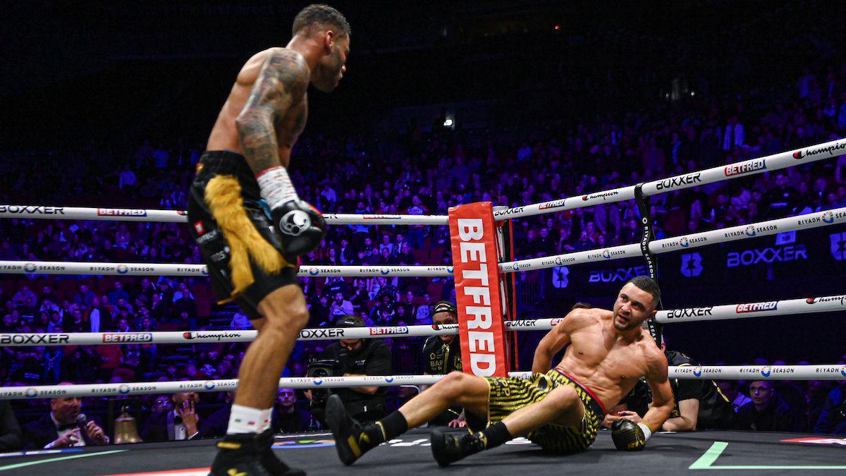 Troy Williamson knocks Callum Simpson down