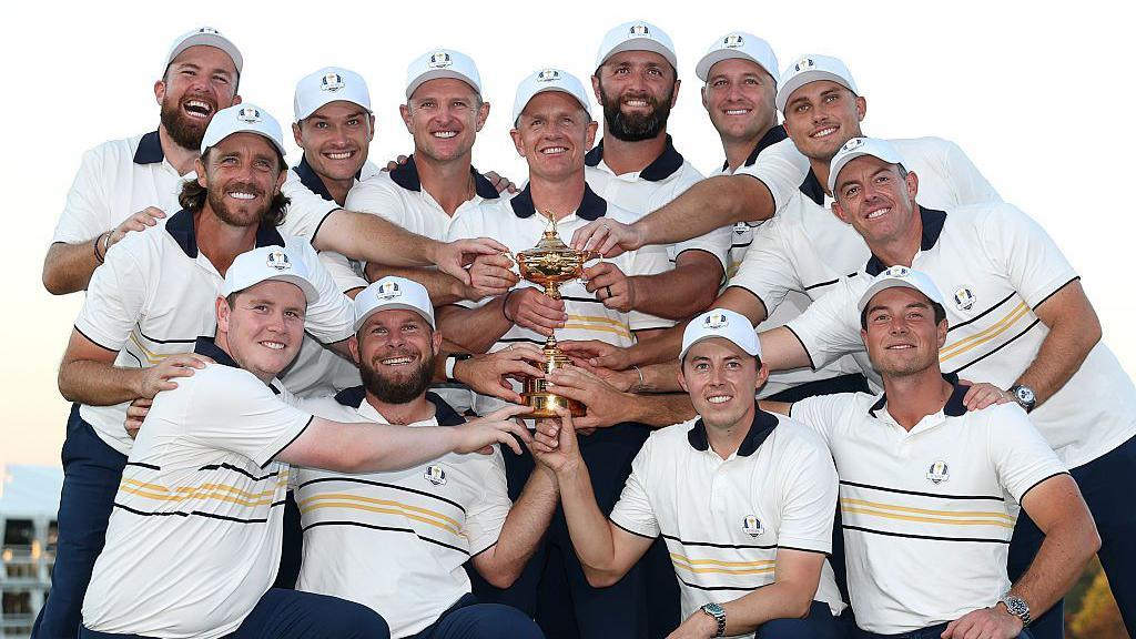 Europe's winning Ryder Cup team pose with the trophy after their victory at Bethpage Black