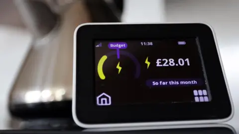 EPA A smart meter showing an electricity reading, with a kettle in the background