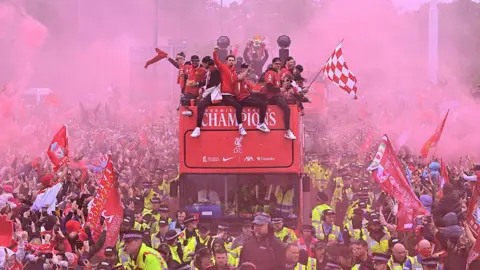Getty Images Liverpool FC players parade through the streets in May