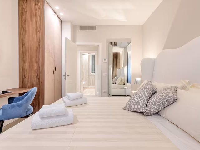 Image may contain: Home Decor, Cushion, Indoors, Interior Design, Lamp, Floor, Bed, and Furniture