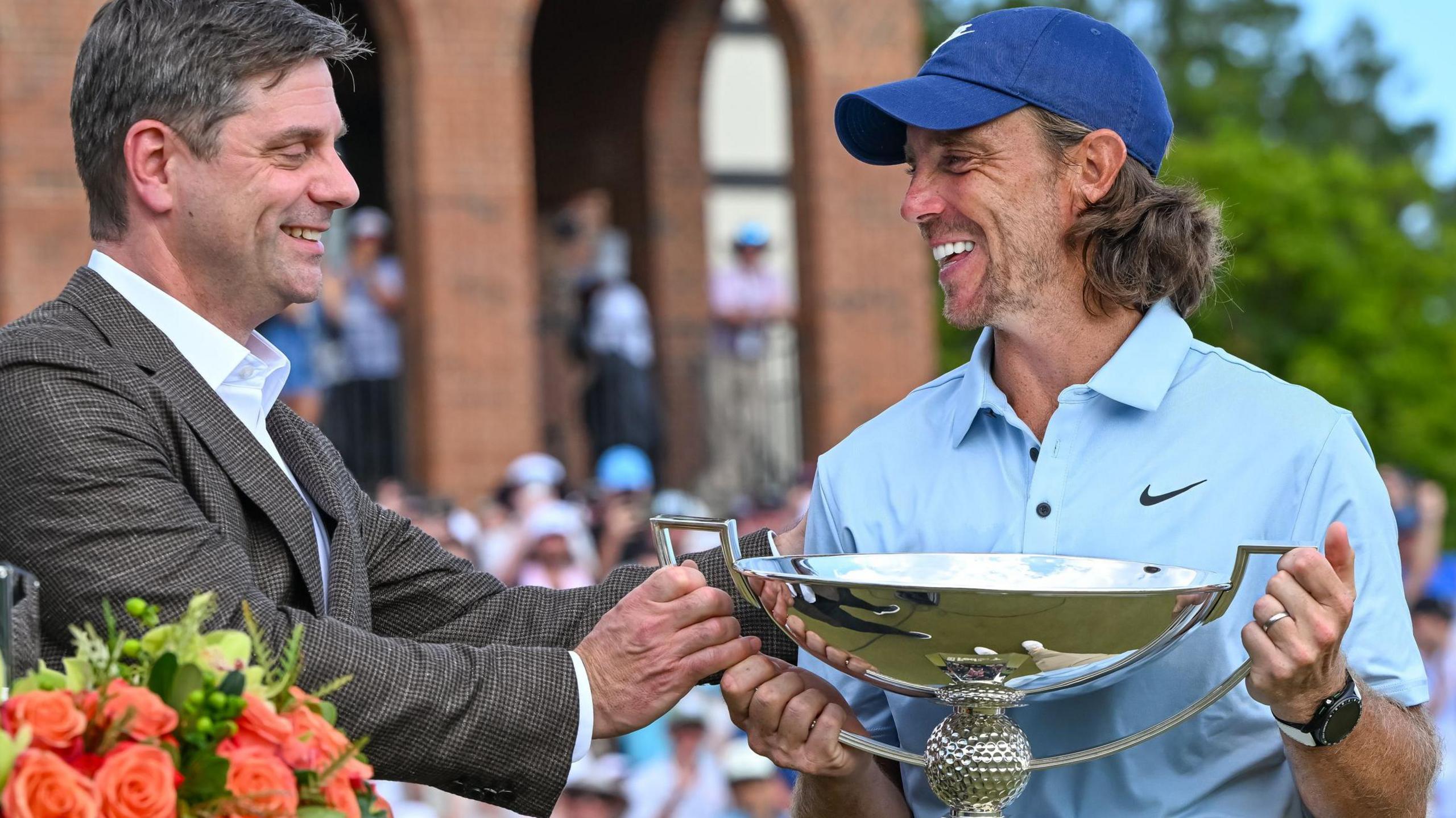 PGA Tour chief executive Brian Rolapp presenting Tommy Fleetwood with the FedEx Trophy after the Englishman won the Tour Championship in August