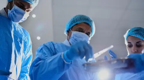 Operations and treatments cut back as NHS orders hospitals to save money