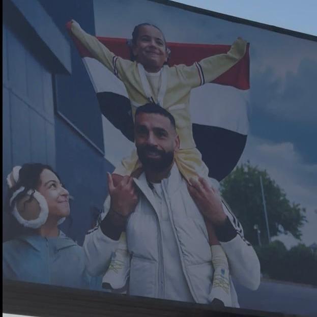 A billboard in Cairo showing Salah and his two daughters