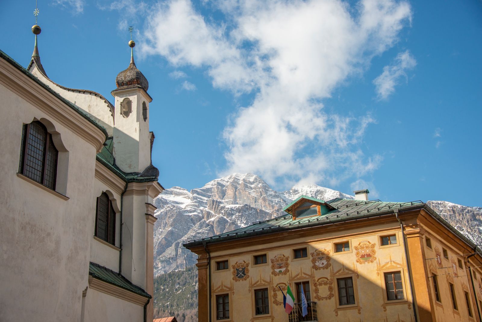 Image may contain Mountain Mountain Range Nature Outdoors Peak Architecture Bell Tower Building and Tower