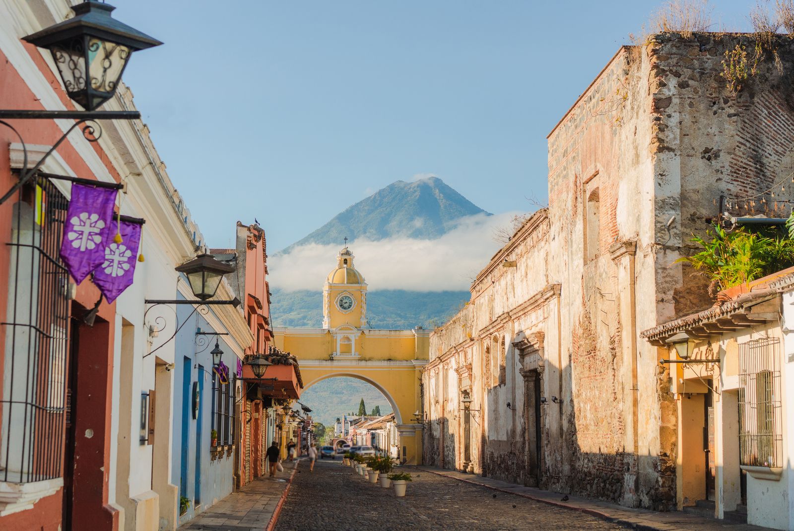 Image may contain City Road Street Urban Arch Architecture Building Cityscape Person Car and Transportation