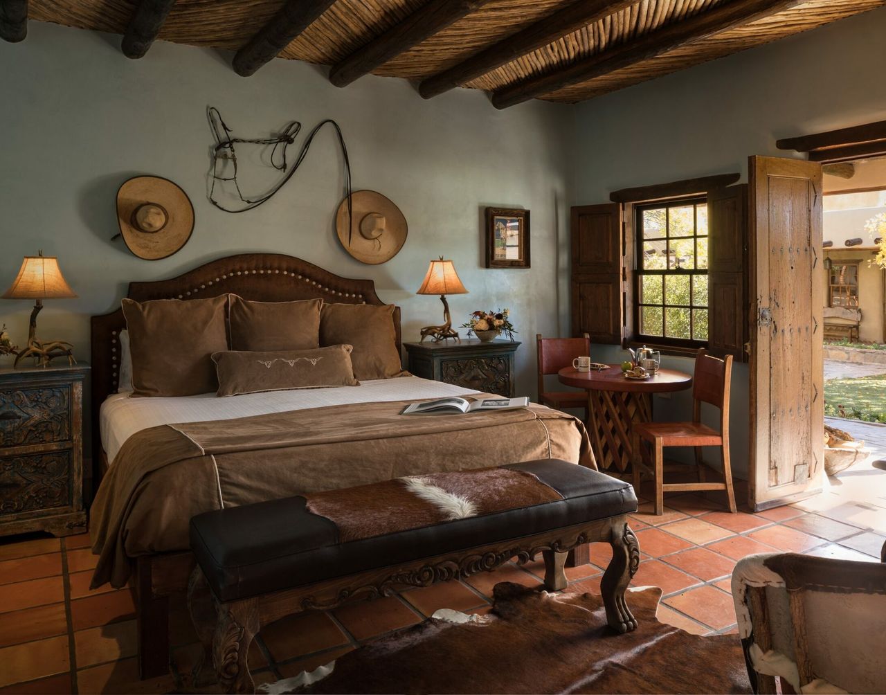 Image may contain: Book, Publication, Lamp, Home Decor, Chair, Furniture, Indoors, Interior Design, Art, Painting, and Cup