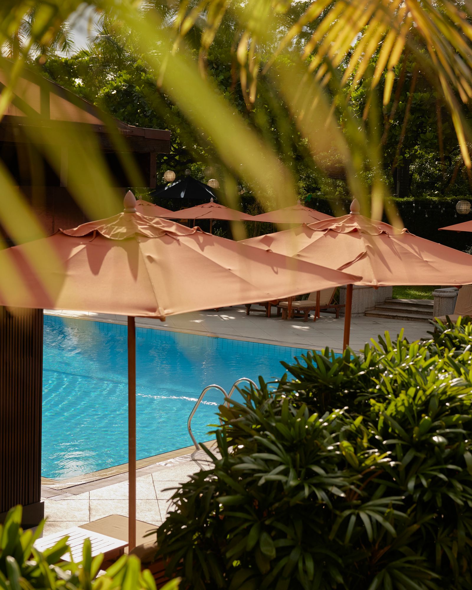 Image may contain Pool Water Swimming Pool Architecture Building Hotel Resort Summer and Outdoors