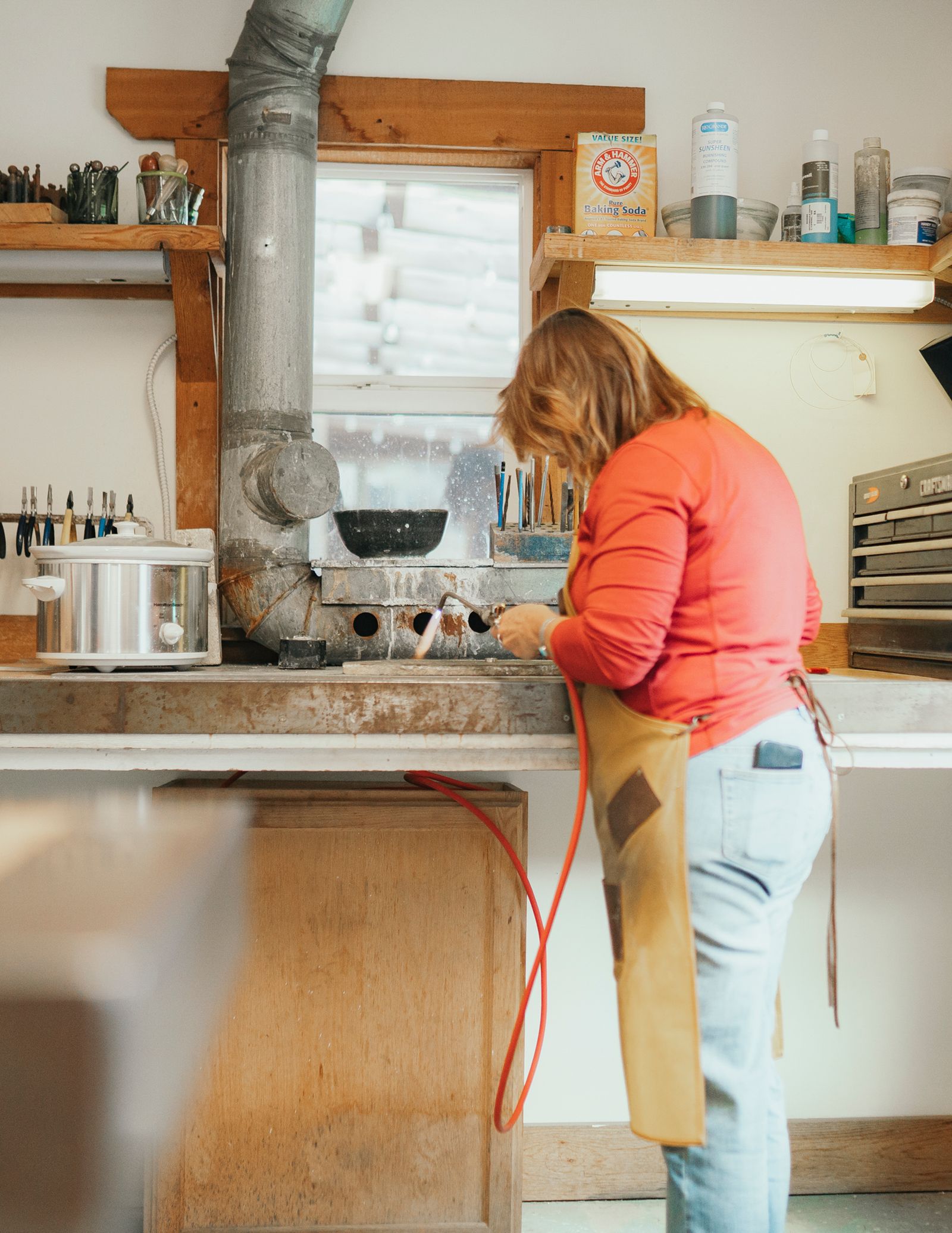 Image may contain Clothing Pants Adult Person Indoors Kitchen and Interior Design