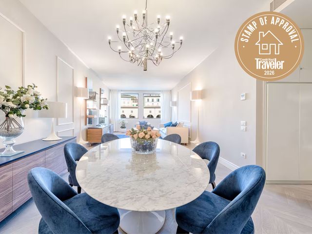 Image may contain: Furniture, Table, Tabletop, Architecture, Building, Dining Room, Dining Table, Indoors, Room, and Plant