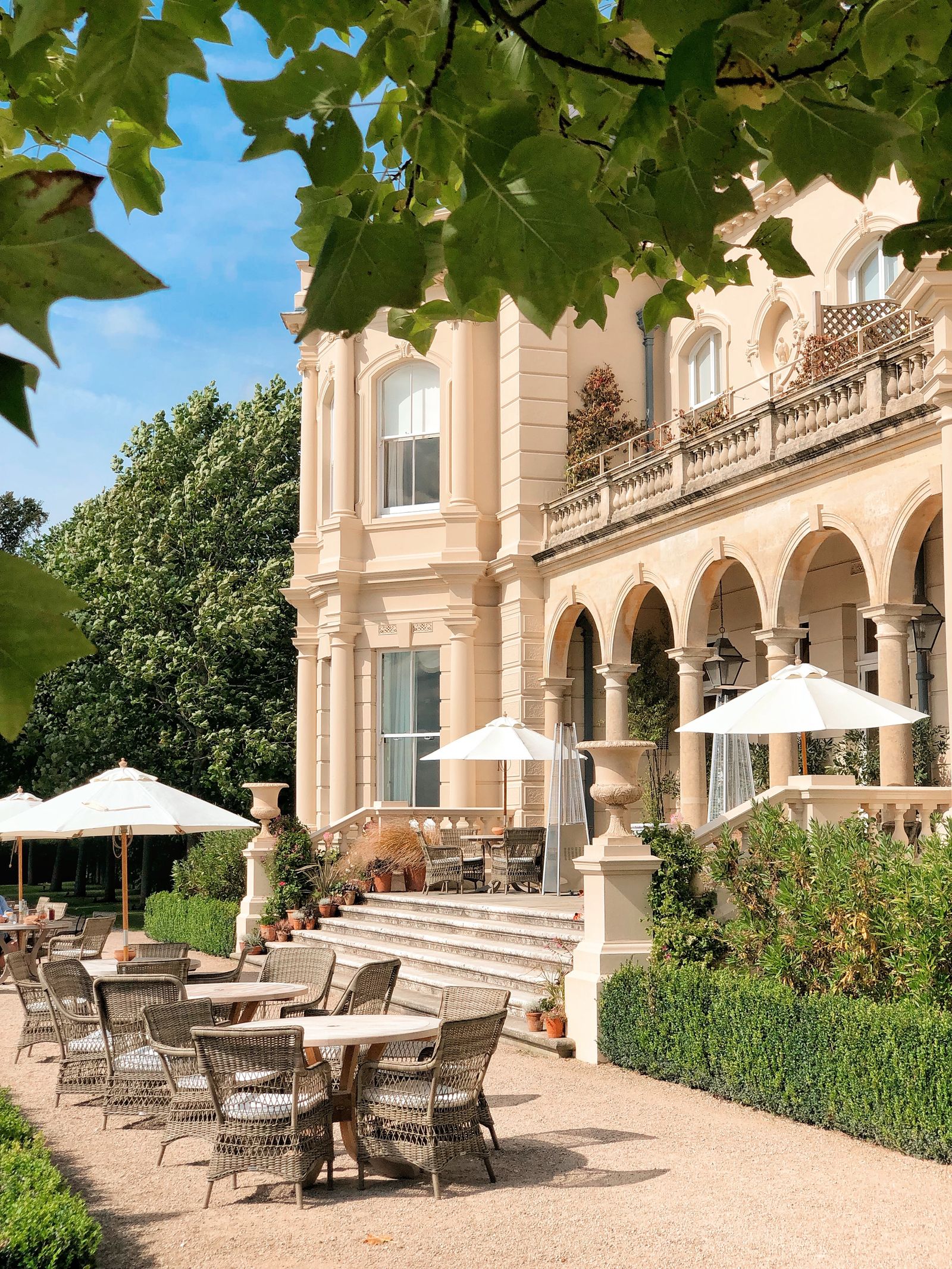 Image may contain Architecture Building House Housing Villa Chair Furniture Portico Arch and Gothic Arch