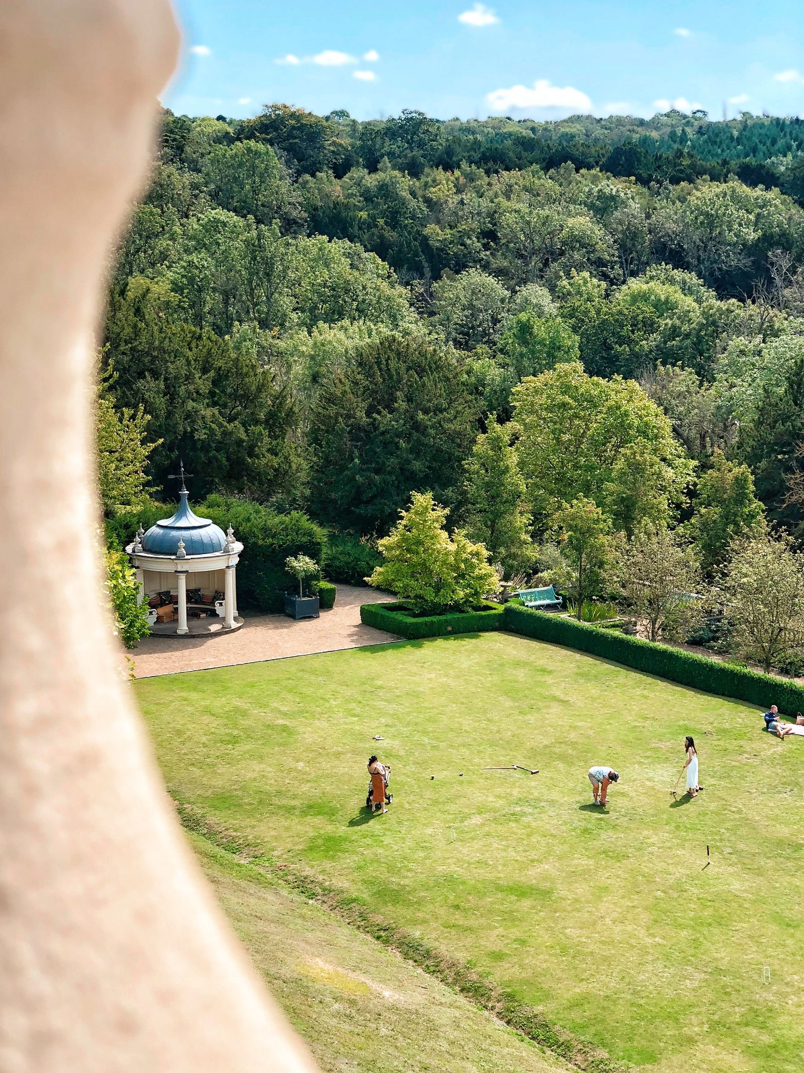 Image may contain Land Nature Outdoors Plant Tree Vegetation Woodland Grass Park and Person