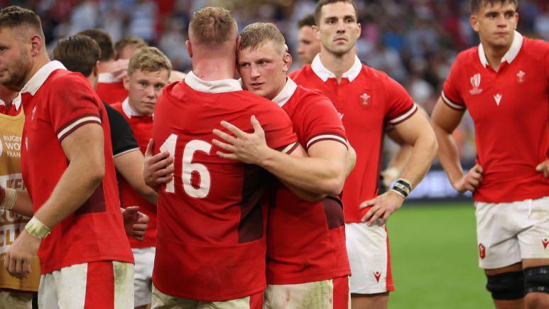 Wales forwards Jac Morgan and Dewi Lake embarce each other on the pitch