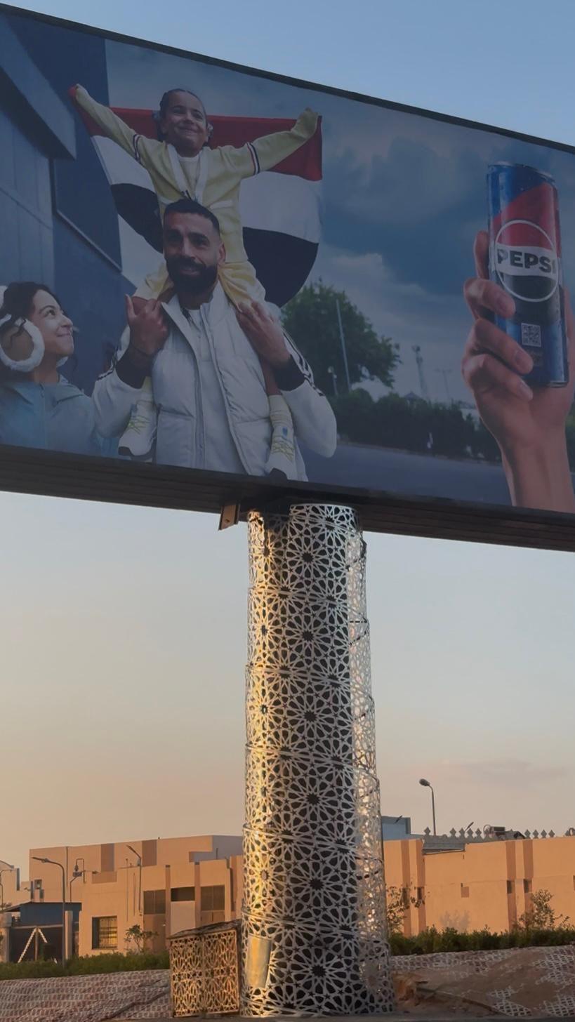 A billboard in Cairo showing Salah and his two daughters