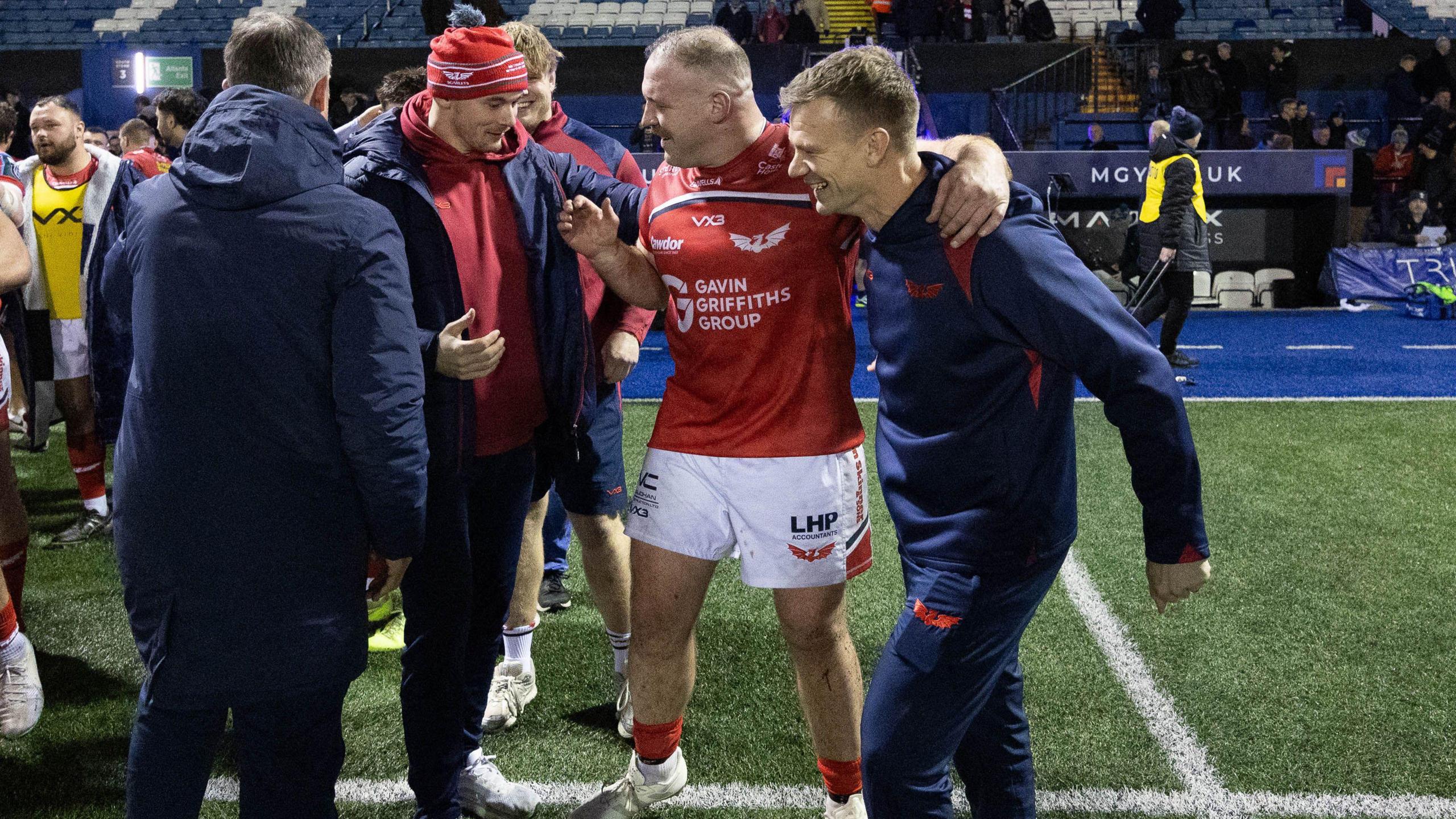 Dwayne Peel (far right) celebrates victory with his Scarlets squad