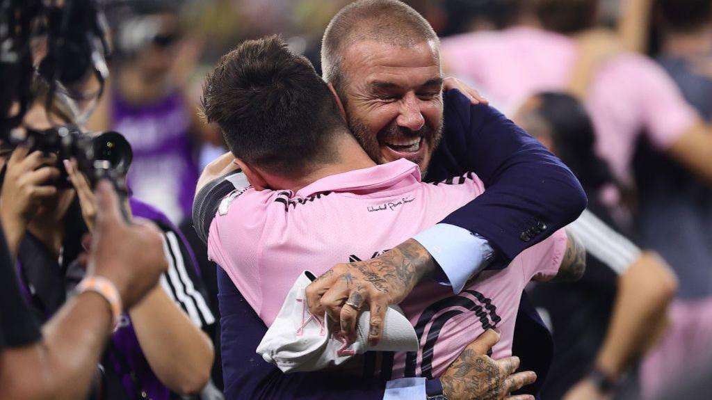 David Beckham hugging Lionel Messi