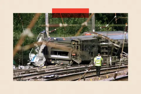 Getty Images  A policeman walks towards the carriages which overturned near Hatfield