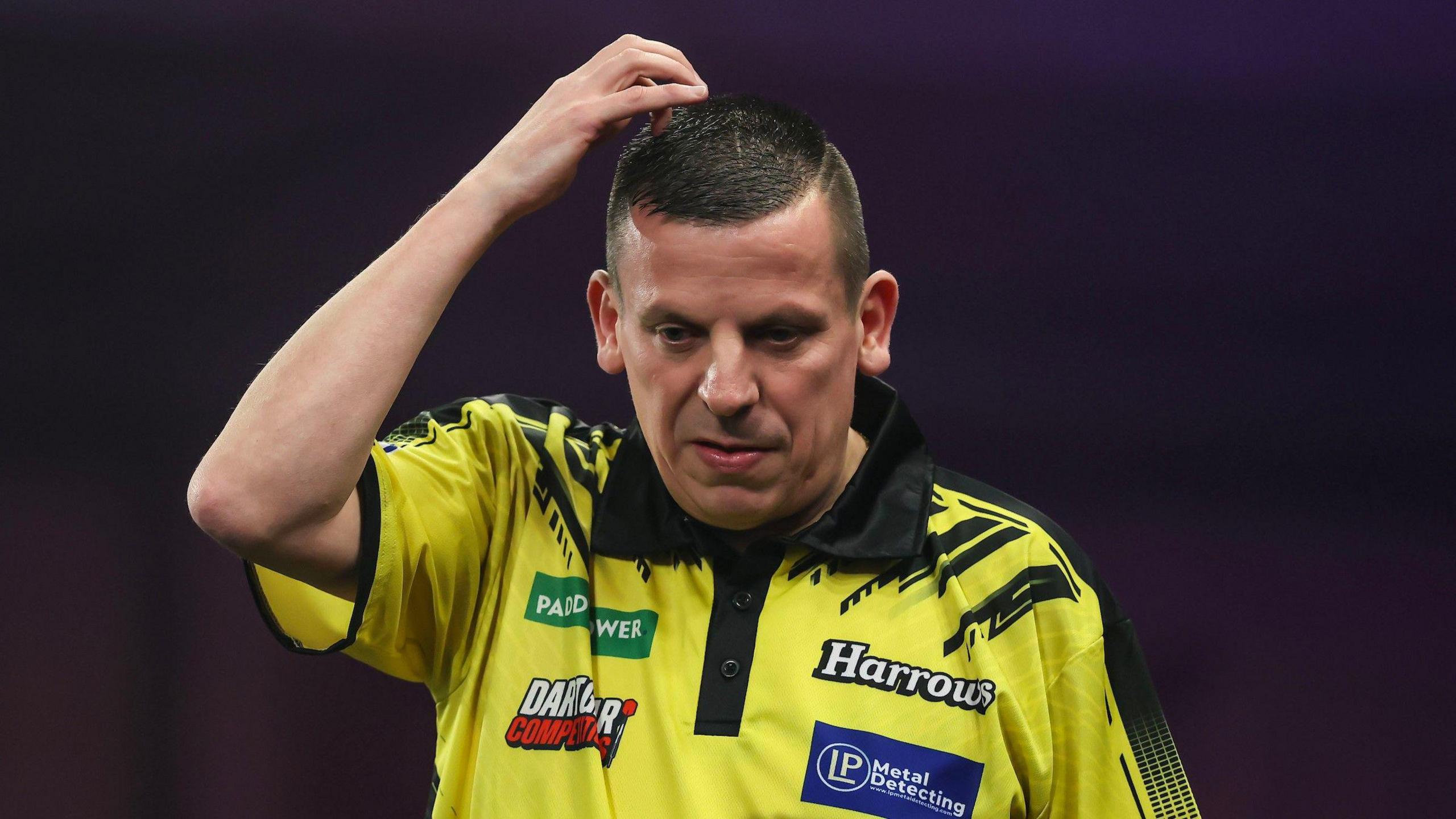 Dave Chisnall looks on