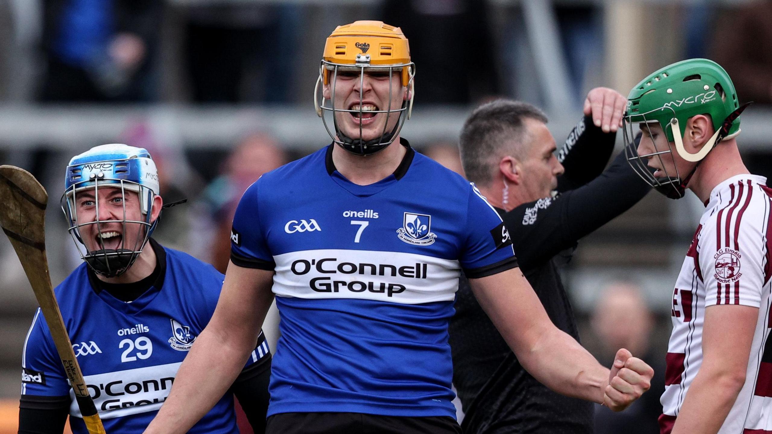 Liam Healy and Luke Elliott celebrate after coming out on the right side of a titanic tussle