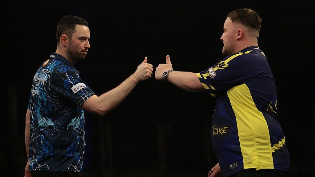 Luke Humphries and Luke Littler bump fists