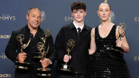 Getty Images Stephen Graham, Owen Cooper, and Erin Doherty, pose in the press room during the 77th Primetime Emmy Awards at Peacock Theater on September 14, 2025 in Los Angeles, California.