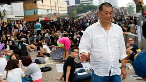 Getty Images Lai stands in the crowd taking part in a sit-in called 'Occupy Central' or 'Umbrella revolution' in Connaught road, Admirality, Hong Kong, on October 2, 2014.