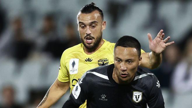 Clayton Lewis of the Wellington Phoenix challenges Kearyn Baccus of Macarthur FC during an Australia Cup quarter-final in August 2022
