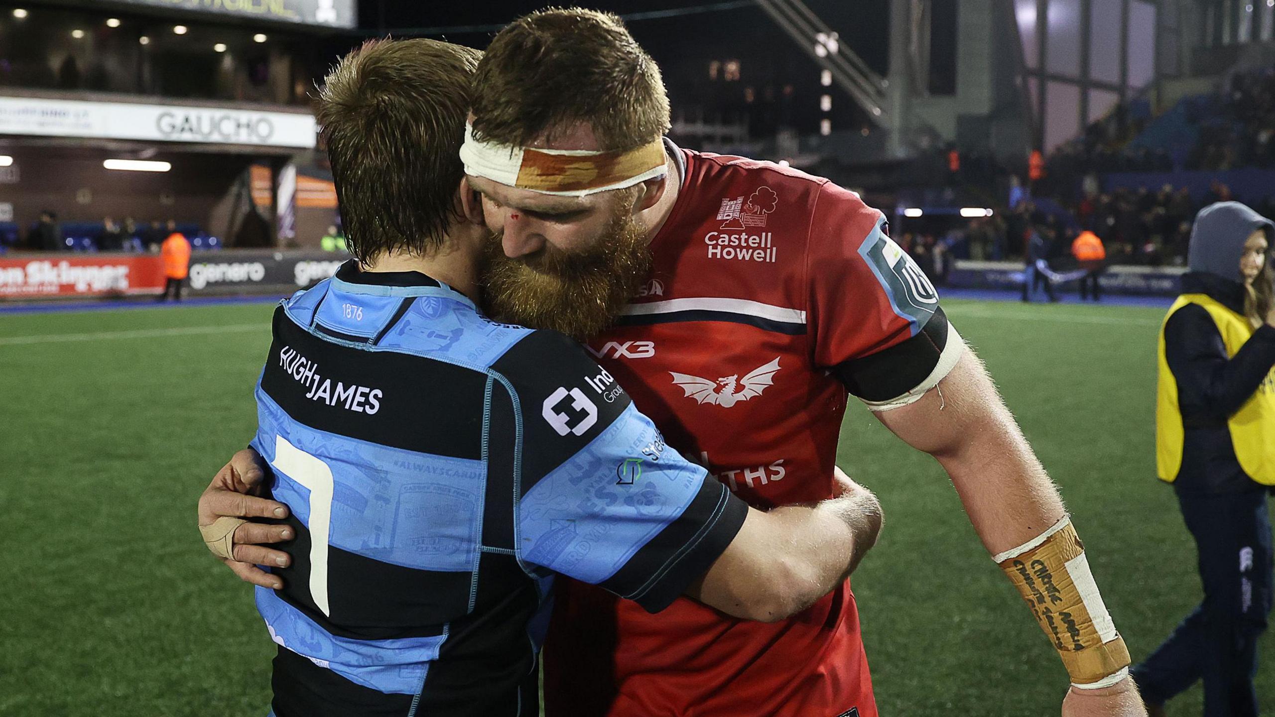 Scarlets lock Jake Ball embraces Cardiff flanker Dan Thomas