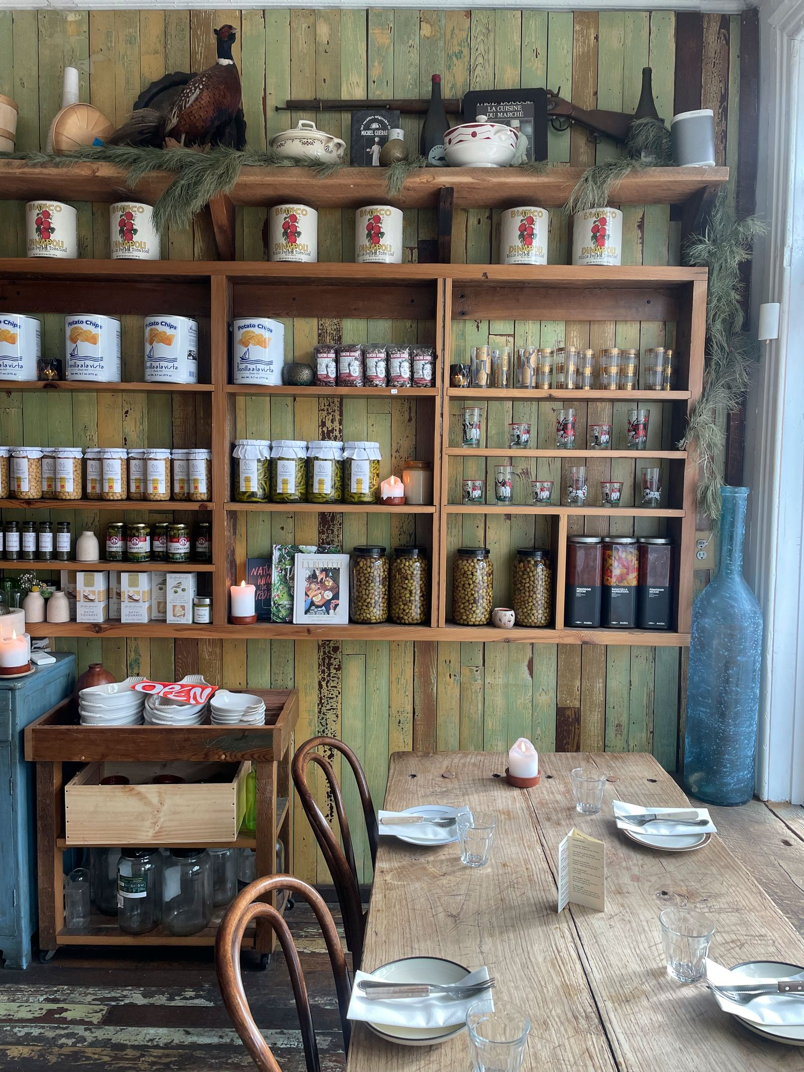 Image may contain Shelf Indoors Interior Design Pantry Cup Candle Furniture Animal Bird Plate and Box